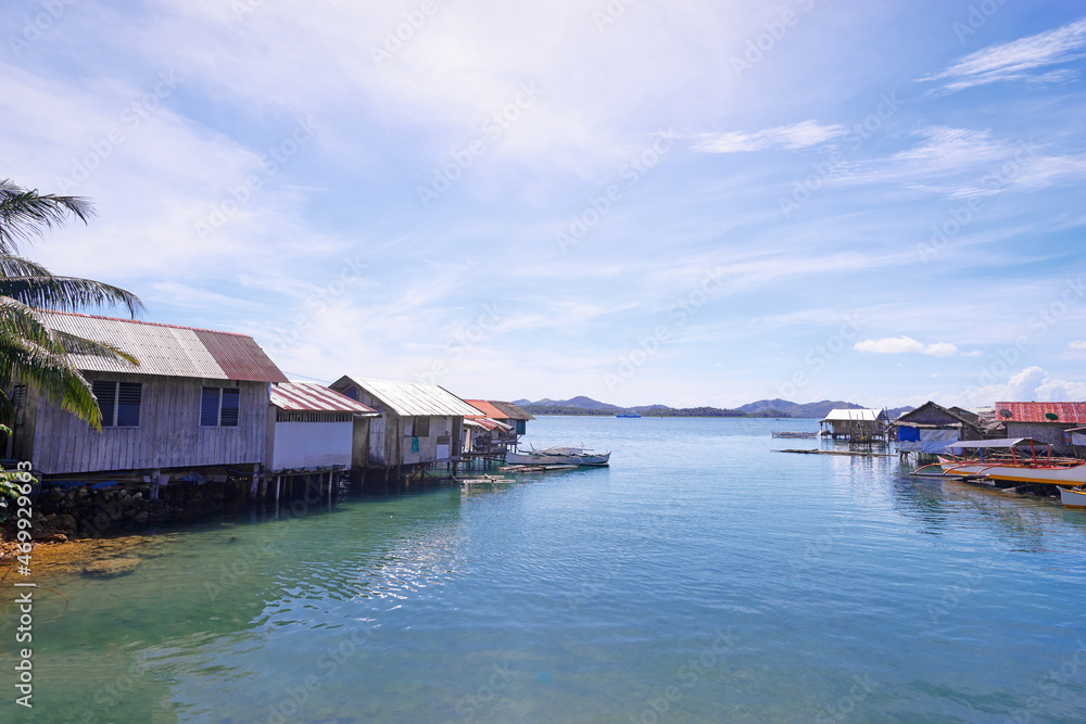Wooden houses of tropical village on the sea shore. Wooden houses of tropical village on the sea shore.