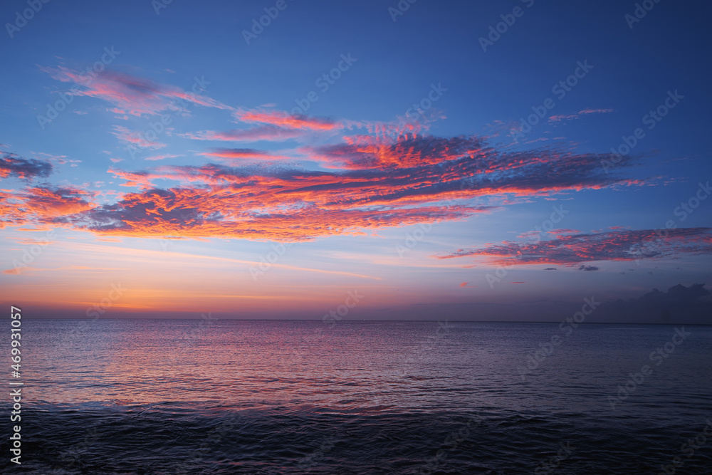 Beautiful seascape with sunset cloudy sky.