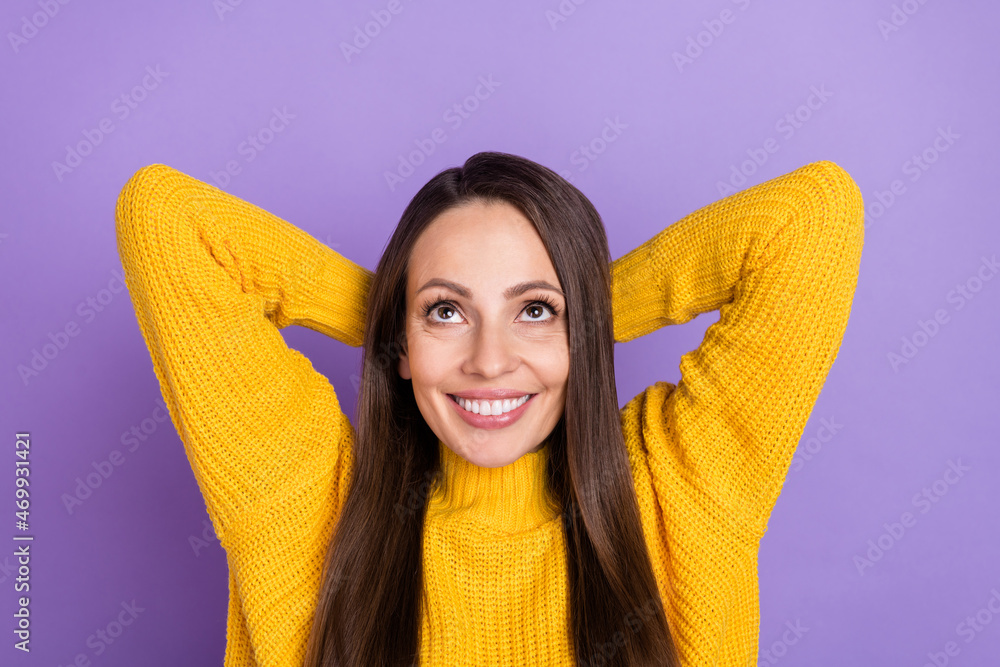 Photo of sweet brunette young lady palms head look up wear yellow pullover isolated on purple color background Photo of sweet brunette young lady palms head look up wear yellow pullover isolated on purple color background