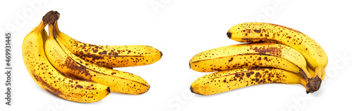 Bunch of ripe bananas isolated on white background. Very ripe bananas with dark spots.