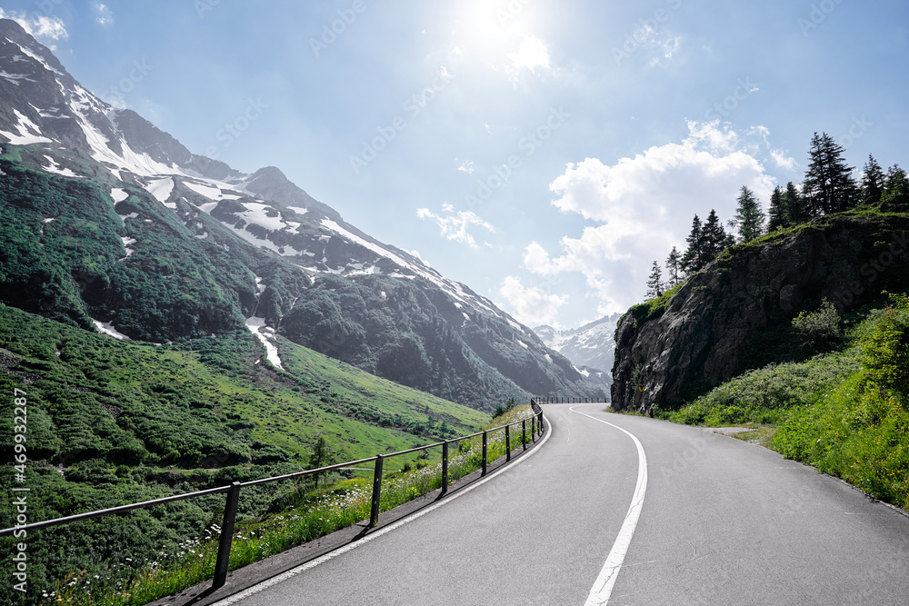 Asphalt road in Alp mountains. Road trip concept. Beautiful landscape.