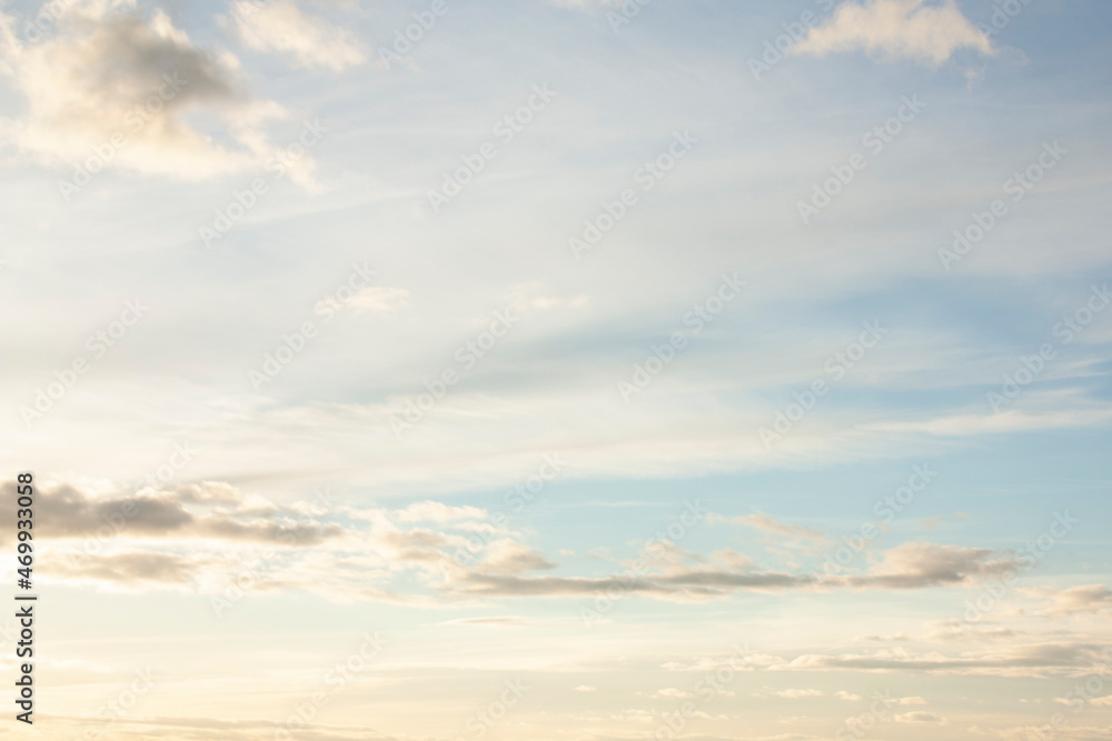 Obraz premium High, fluffy clouds during sunset in the evening. 