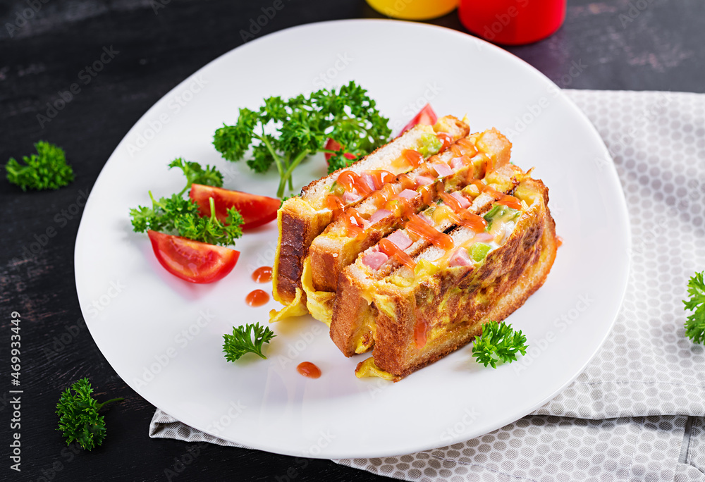 Roasted sandwich cheese,hm, peppers and scrambled eggs on white plate. Dark background. Roasted sandwich cheese,hm, peppers and scrambled eggs on white plate. Dark background.