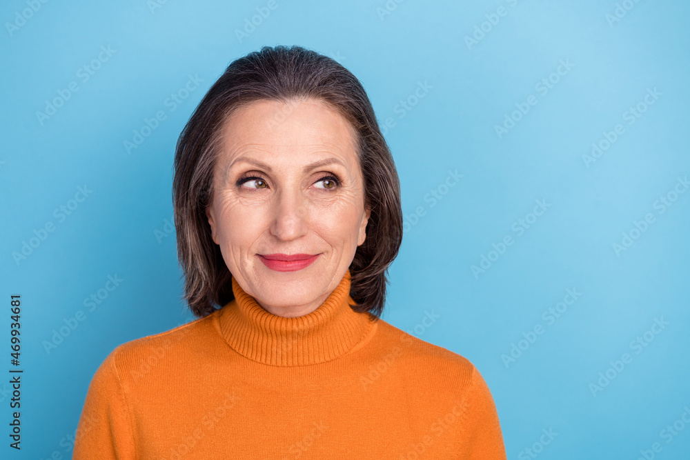 Photo of pretty positive minded person look empty space dream dreamy isolated on blue color background Photo of pretty positive minded person look empty space dream dreamy isolated on blue color background