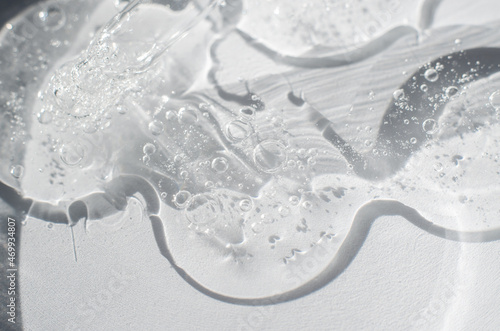 Transparent gel structure with air bubbles, close-up. Gel in a petri dish