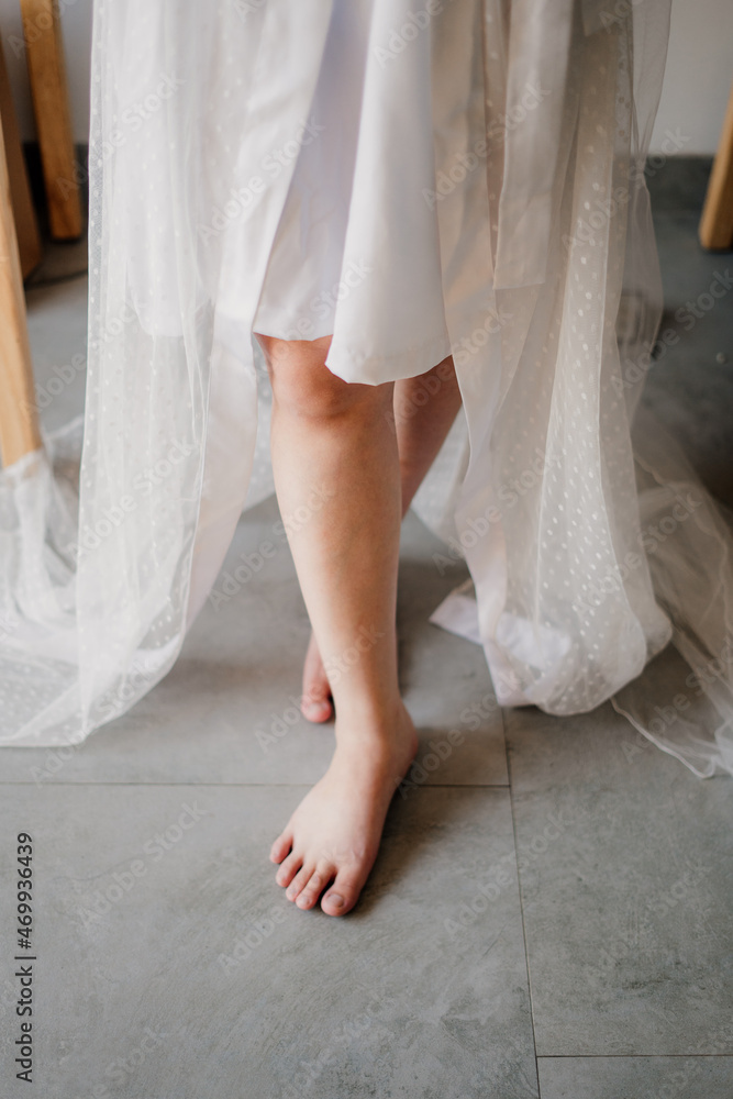 Chinese woman's legs in a crossed position are stepping forward Chinese woman's legs in a crossed position are stepping forward