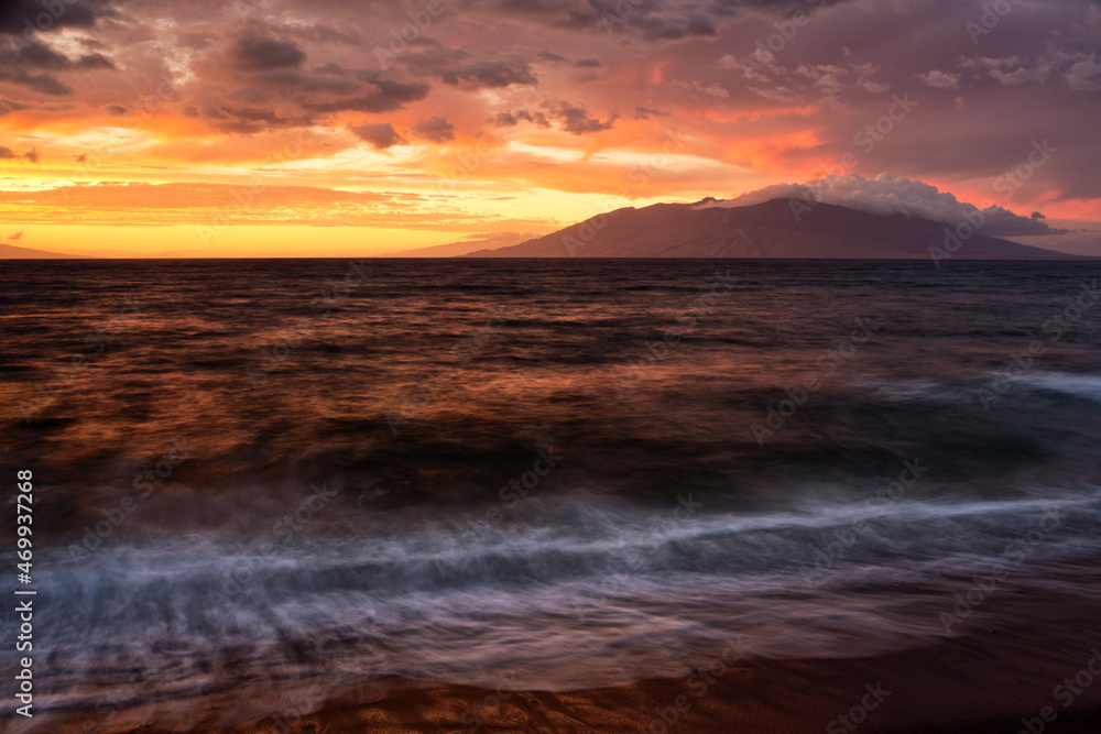 Sunset over the West Maui Mountains viewed from Oneuli Beach.