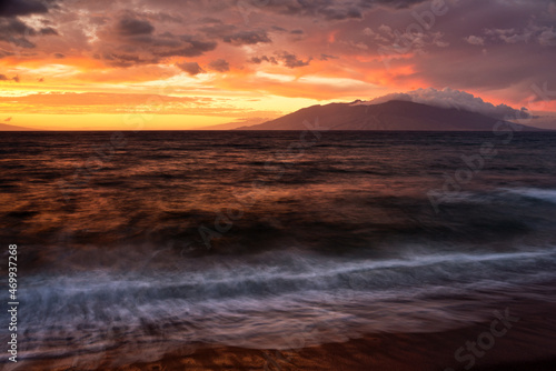 Sunset over the West Maui Mountains viewed from Oneuli Beach.