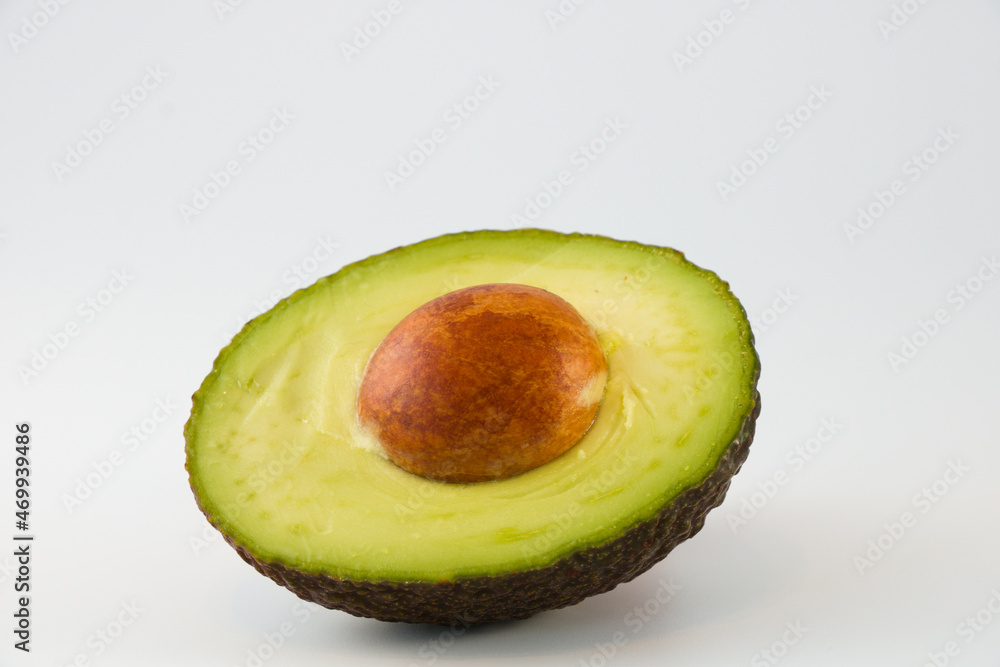 Half of avocado isolated on white background