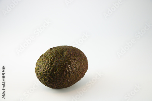 Whole avocado isolated on white background with copy space