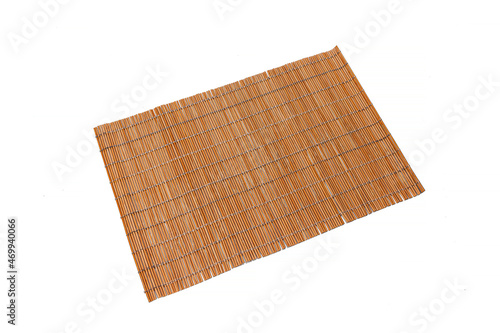 Bamboo rug for making sushi on a white isolated background. Kitchenware.
