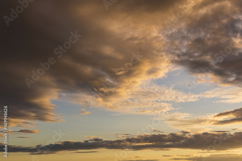 bright golden color sunset clouds on beautiful sky