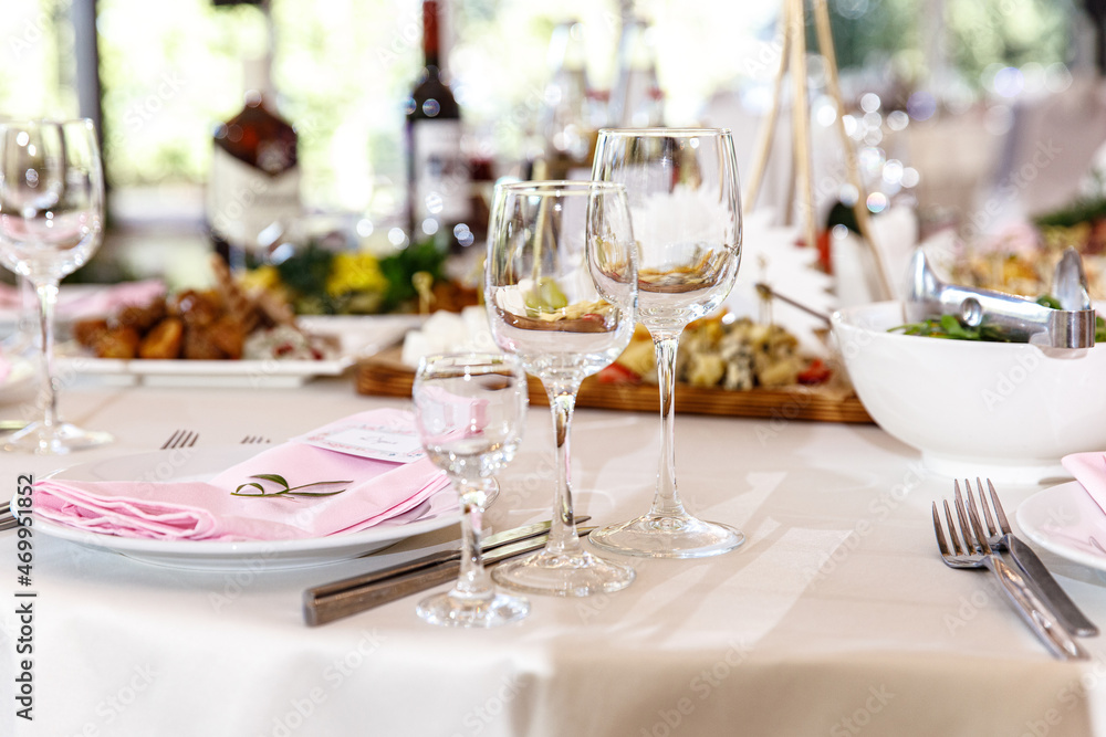 Table setting for an event party or wedding in the restaurant decorated Table setting for an event party or wedding in the restaurant decorated