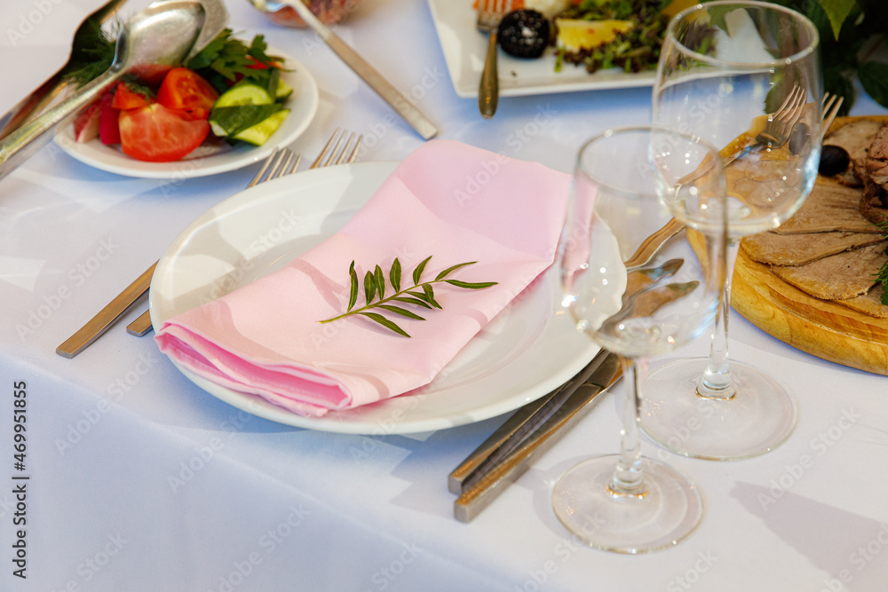 Table setting for an event party or wedding in the restaurant decorated Table setting for an event party or wedding in the restaurant decorated