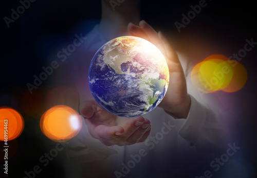 World in our hands. Woman holding digital model of Earth  closeup view