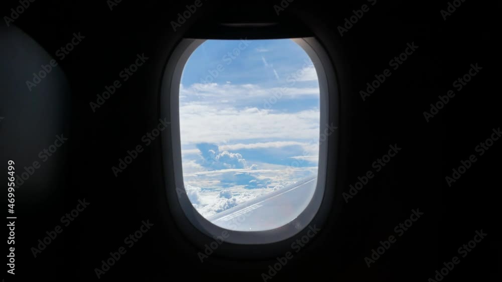 View from in side plane cabin through plane window while storm raining outside View from in side plane cabin through plane window while storm raining outside