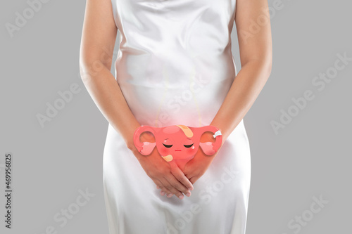 Illustration of the uterus is on the woman's body photo