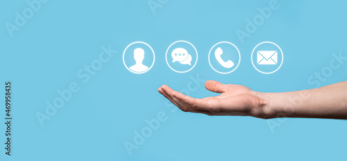 Businessman hand holding,pressing on icon phone, mail, telephone,message,post and person,user. Customer service call center contact us concept.Banner,copy space.Contact Methods.