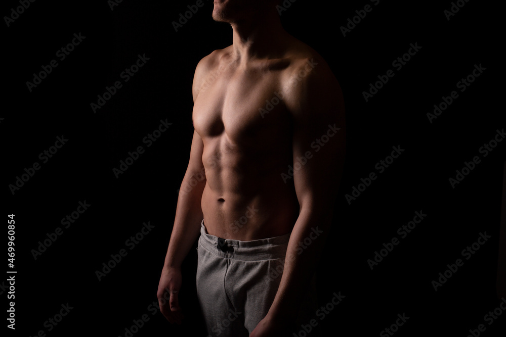 Man Showing ABS. Muscle man Posing. Strong Body Concept. Topless Sport man Bodybuilder. Six Pack Spotsman