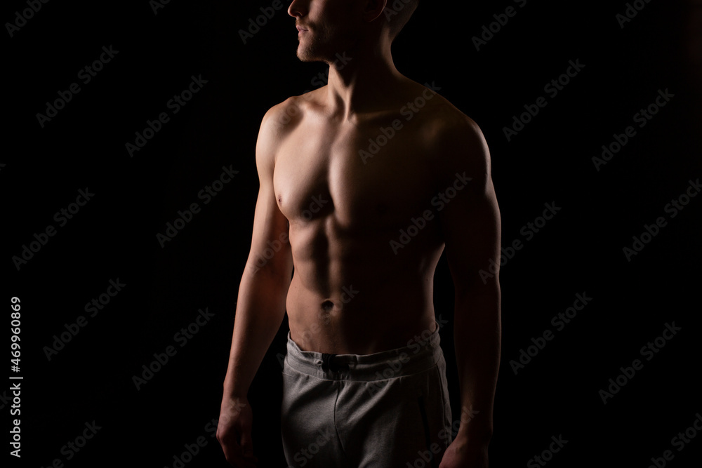 Man Showing ABS. Muscle man Posing. Strong Body Concept. Topless Sport man Bodybuilder. Six Pack Spotsman