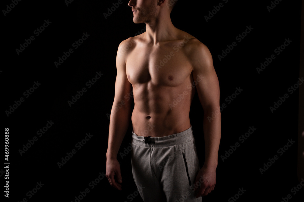 Man Showing ABS. Muscle man Posing. Strong Body Concept. Topless Sport man Bodybuilder. Six Pack Spotsman