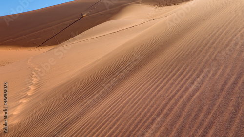 Red sand dunes covered in footprints - Footprints in desert sand covered by wind - Dead Vlei - Sossusvlei  Namib desert  Namibia