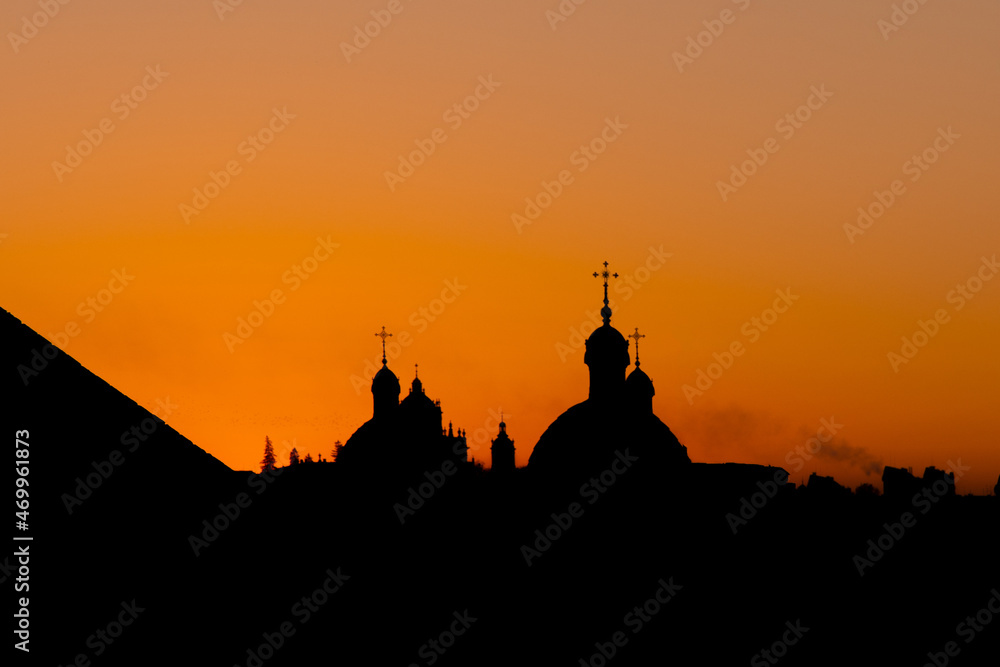 city silhouette of cathedral dome Islamic religion building in fire with smoke on evening dusk lighting and bright orange illumination on background space
