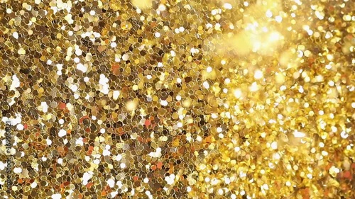 The golden confetti is falling . Festive rain of confetti.