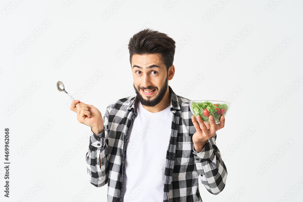 man in plaid shirt eating salad healthy food man in plaid shirt eating salad healthy food