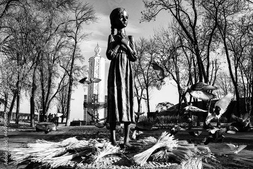 Pigeons fly near the Monument to the victims of Holodomor big hunger in Ukraine who died of starvation in 1932-33. Kyiv photo