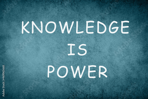 Knowledge is power, phrase on a blue colored background, education concept, strategy