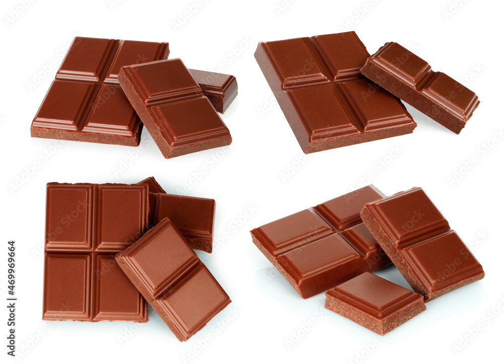 Broken milk chocolate bar set isolated on white background Broken milk chocolate bar set isolated on white background