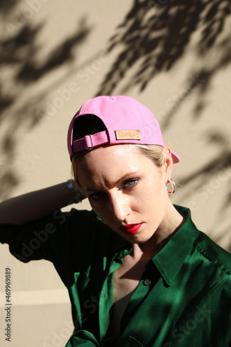 Vertical headshot of hipster girl wears colourful clothes  posing outdoor.