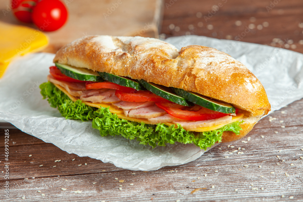 Breakfast of Fresh croissant with ham, cheese and salad leaf on white wooden background. Breakfast of Fresh croissant with ham, cheese and salad leaf on white wooden background.