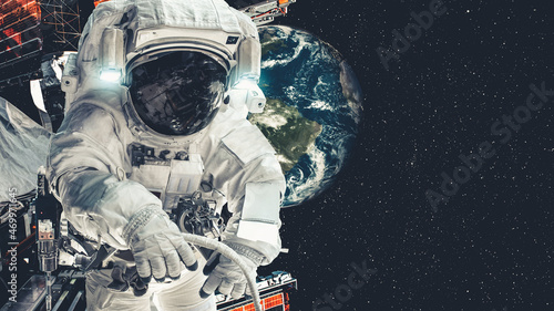 Astronaut spaceman do spacewalk while working for spaceflight mission at space station . Astronaut wear full spacesuit for operation . Elements of this image furnished by NASA space astronaut photos . photo