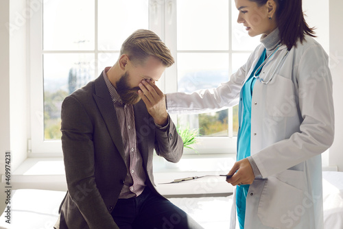 Patient visits doctor at hospital, gets bad news and loses hope. Devastated terrified adult man crying after learning of treatment failure or incurable oncological disease of family member or relative