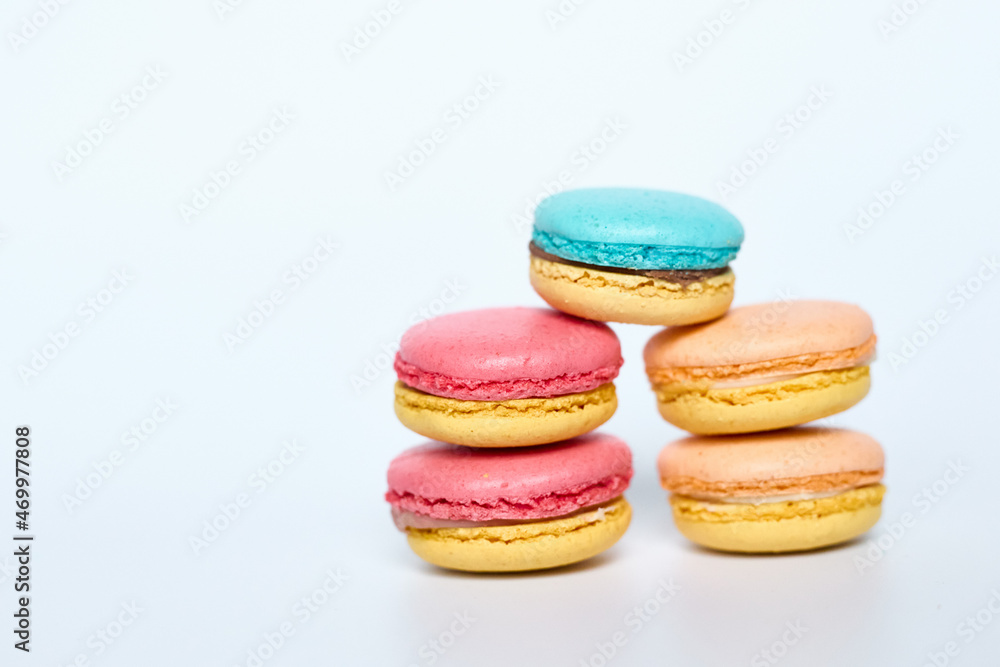 Macaroons lie on a white background