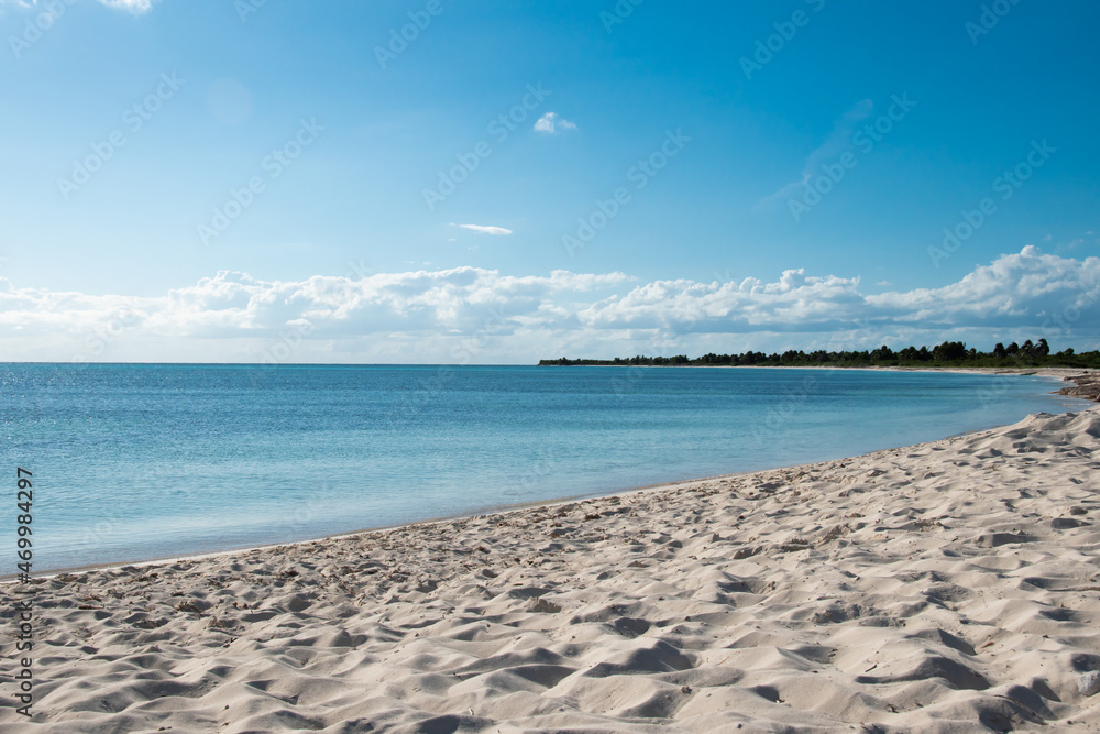 Summer beach background. Sand, sea and blue sky