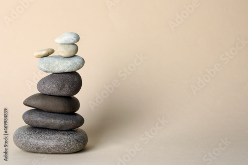Stack of stones on beige background  space for text. Harmony and balance concept