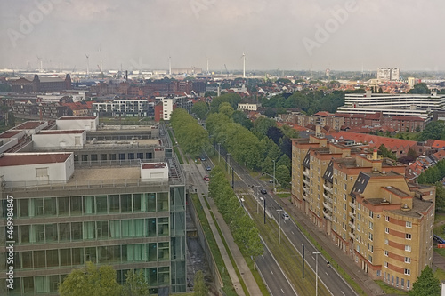 Aerial view of Opgeeistenlaan streeet in Rabot, residential neighborhood, Ghent, Belgium, with the modern court building, apartment blocks and a road with trees and a tram  photo
