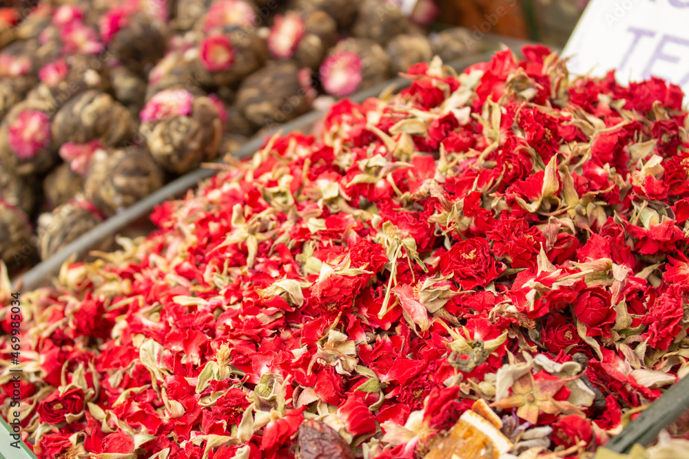 Exotic floral red rose tea at spice stall. Souvenir market shopping. Asian and chinese tea culture. Organic dried floral tea