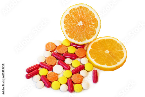 Various vitamins  herbal supplements and other pills near lemon slices isolated on white background.