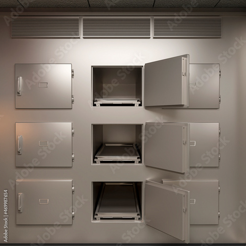 three doors open of nine drawer on autopsy room scene