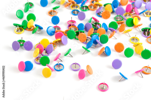 Set of colored push stationery pins. White background. 
