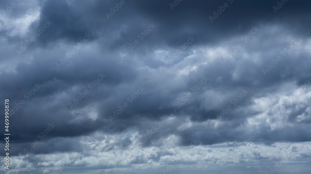 Dark storm clouds make the sky in black. Rain is coming soon. Nature background. Dark storm clouds make the sky in black. Rain is coming soon. Nature background.