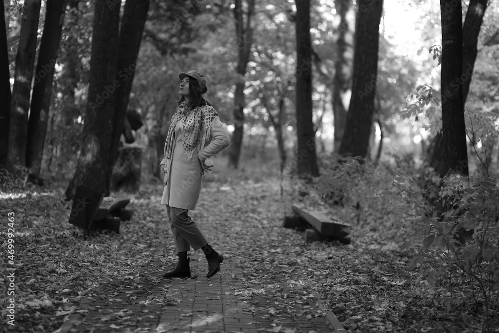 Black and white portrait of woman standing in the park Black and white portrait of woman standing in the park