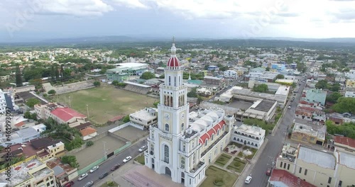 Aerial traveling out view of Sacred Heart of Jesus Church, Moca City, Espaillat Province, Dominican Republic. Toma aérea Parroquia Sagrado Corazón De Jesús Ciudad de Moca Provincia Espáillat 