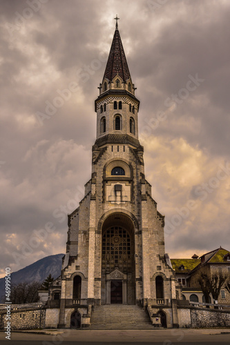 Church in Annecy, France, called Basilique de la Visitation with a dramatic sky. Symmetrical photograph. 