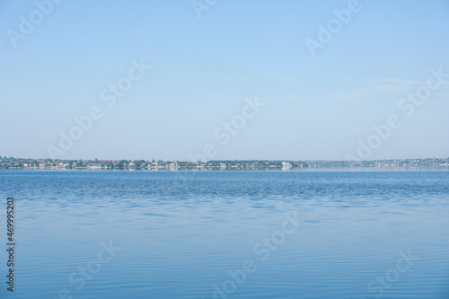Picturesque view of calm river under blue sky