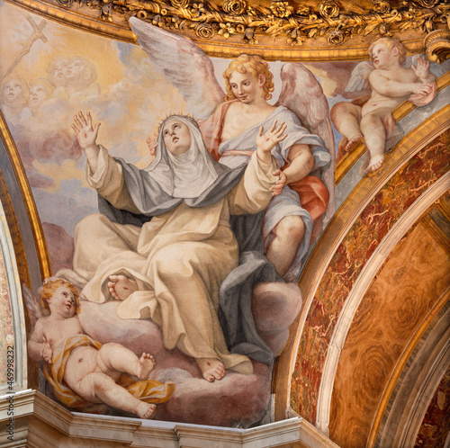 ROME, ITALY - SEPTEMBER 2, 2021: The fresco of Stigmatization of St. Catherine of Siena in the cupola of church Basilica di Santa Sabina by Giovani Battista Contini (1671).